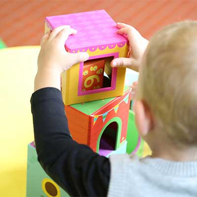 Happy children playing with building blocks at Little Stars Play School